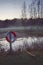 Lifebuoy in front of pond in field during foggy day