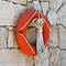 Lifebuoy hanged on stone wall