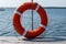 Lifebuoy hanging on the handle of the pier. The concept of saving drowning