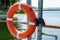 Lifebuoy hanging on the handle of the pier. The concept of saving drowning