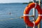 Lifebuoy hanging on the handle of the pier. The concept of saving drowning