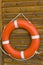 Lifebuoy hanging on a wooden wall