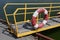 Lifebuoy hangs on the railing of the transitional bridge