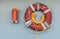 Lifebuoy with light and smoke on the wall of the ship for use in case of emergency