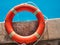 Lifebuoy lying on the background of the pool