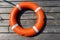 The lifebuoy is lying on a wooden pier. The concept of saving drowning