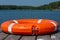 The lifebuoy is lying on a wooden pier. The concept of saving drowning