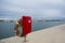 Lifebuoy in the marina for yachts. Red circle on the boat dock. uxury Yachts And Boats In Valencia Port At Mediterranean