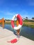 Lifebuoy in red and white color on a wood joist