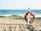 Lifebuoy on a sandy sea beach in Terracina, Italy. Safe swimming