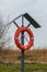 Lifebuoy stand in a small harbor