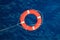 Lifebuoy in a stormy blue sea, safety equipment in boat.