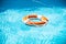 Lifebuoy in swimming pool. Summer vacation concept. Life buoy in water. Help concept.