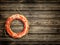 Lifebuoy at wooden background