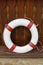 Lifebuoy on wooden fence