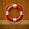 Lifebuoy on a wooden wall.