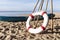 Lifebuoys for tourists are prepared on the beach in front of the resort