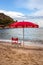 Lifeguard Chair and parasol at empty beach of Fetovaia, Island of Elba, Tuscany, Italy; swimmers rescue and safety concept