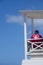 Lifeguard controls the beach from his tower