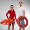 Lifeguard couple with rescue equipment