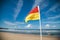 Lifeguard flag flying on patrolled beach at Coffs Harbour on sunny day