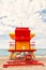 Lifeguard house red, orange color on sandy beach, Miami, Florida