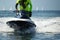 Lifeguard on a jet ski patrols the beach