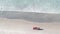 Lifeguard red pickup truck, life guard auto on sand, California ocean beach USA.