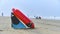 lifeguard with a rescue orange buoy. Security measures on the beach lifesaver watching the sea