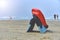 lifeguard with a rescue orange buoy. Security measures on the beach lifesaver watching the sea