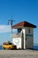 Lifeguard shack and yellow pick up truck