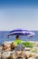 A lifeguard stands on guard over swimmers on the Mediterranean beach at Juan les Pins