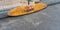 A lifeguard surfboard propped up against the wall ready to go  , Fistral Beach UK , 7/21/2022