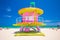 Lifeguard tower in a colorful Art Deco style, with blue sky and Atlantic Ocean in the background. World famous travel location. So