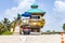 Lifeguard tower at Jade beach in Sunny Isles beach with a motor cart and a rescue surfboard. The lifeguard tower is run by