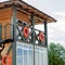 Lifeguard tower for rescue baywatch on beach. Wooden house on sea shore on cloudy sky background. Summer vacation and resort.