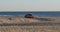 Lifeguard truck driving in the sand on the beach