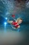 Lifeguard underwater in the pool