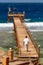 A Lifeguard Walking Along the Pier Among the Wild Waves at Calimera Habiba Beach Resort
