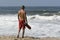 Lifeguard walking towards ocean