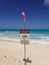 Lifeguard warning sign place in the sand on the beach warning of