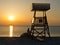Lifeguard watchtower at sunset on the beach