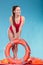 Lifeguard woman on duty with ring buoy lifebuoy.