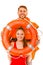 Lifeguards in life vest with ring buoy having fun.