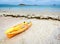 Lifeguards rescue surfboard and kayak lying on the beach