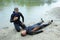 Lifeguards showing position of drowning body before doing mouth-to-mouth resuscitation