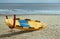 Lifeguards surfboard on a beach.