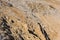 Lifeless desert rocky mountainside with sharp rocks