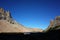 Lifeless rocky mountain landscape, Valley of Toncek lagoon in shadow of Torre Principal peak surrounded by steep granite rocks