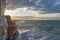 Liferaft, orange lifeboat ready for evacuation from the board, hanging on the side of a cruise ship